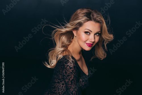 Attractive blond woman with wavy hairstyle and sexy red lips