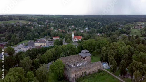 Medieval Castle Ruins in Latvia Rauna.  Aerial View Over Old Stoune Brick Wall of Raunas Castle Where Was Living Archbishop in Middle Age in Latvia. Dron 4k Video photo