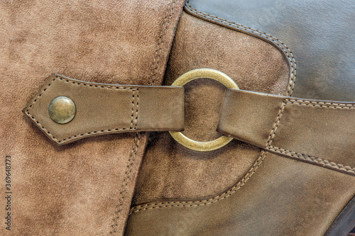 copper ring on a leather boot