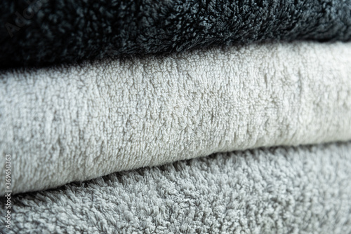 Background of the detail of a terrycloth towels in different shades of gray and white.