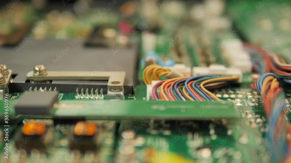 unscrewing screw from circuit board with a power drill. Camera tracks. HD unscrewing screw from circuit board with a power drill. Camera tracks. HD