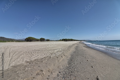 Sand and blue sea in Perdepera beach. Sardinia, Italy