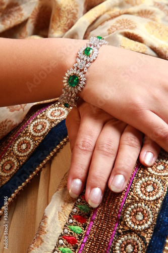 Hands of a model wearing bridal jewelry