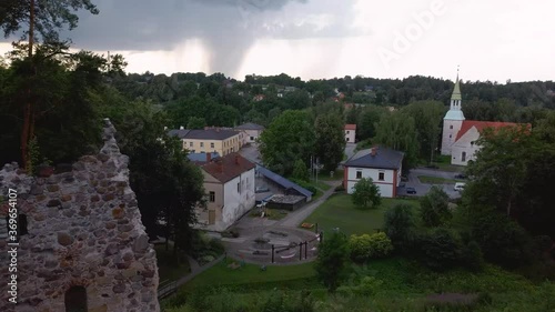 Medieval Castle Ruins in Latvia Rauna.  Aerial View Over Old Stoune Brick Wall of Raunas Castle Where Was Living Archbishop in Middle Age in Latvia. Dron 4k Video photo