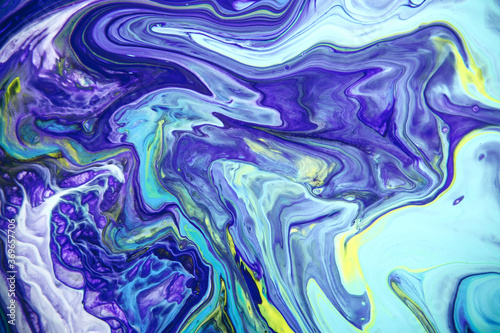 Acrylic paint fluid in trend purple shades mix color background.