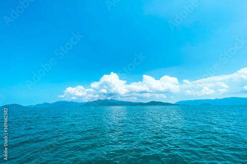 Clear water on the island,Bright blue sea and wooden boat The tourism