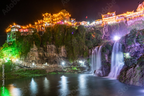 Furong Ancient Town illuminated at night. Amazing beautiful landscape scene of Furong Ancient Town (Furong Zhen, Hibiscus Town), China