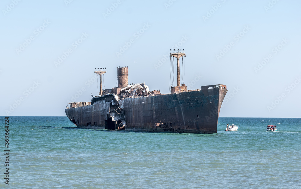 A shipwreck. An old wreck abandoned at sea. The wreck of the ship 