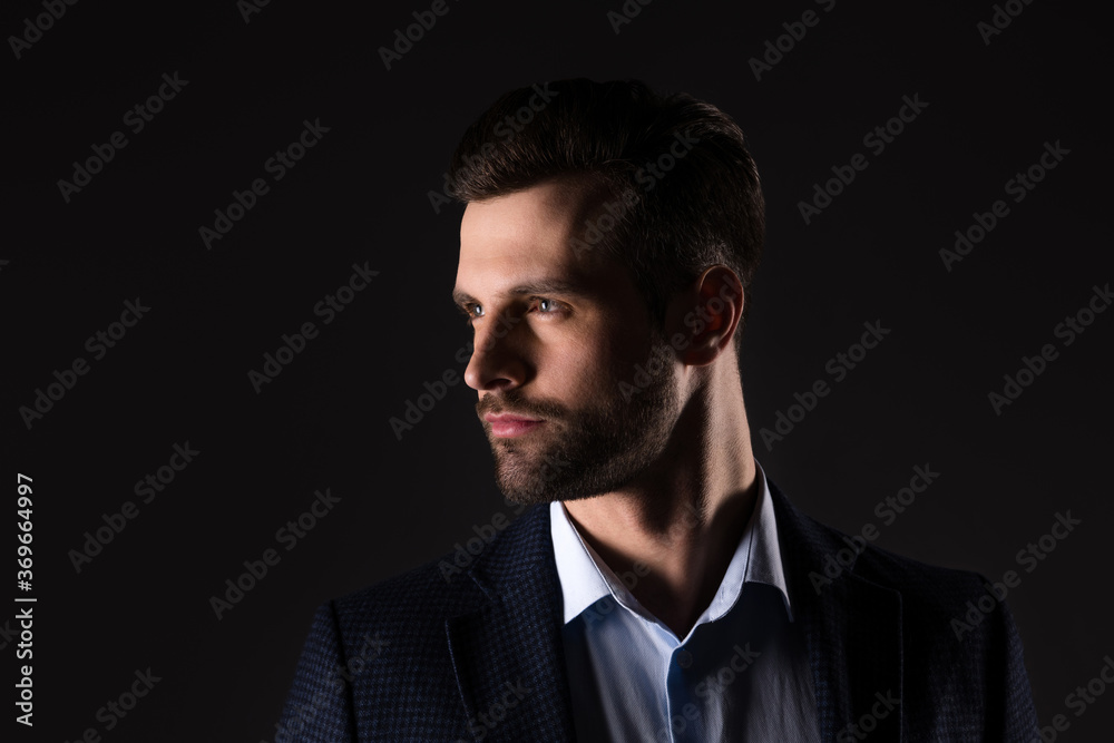 Close-up portrait of his he nice attractive content chic classy corporate employee man banker agent broker financier wearing jacket isolated over dark black color background Close-up portrait of his he nice attractive content chic classy corporate employee man banker agent broker financier wearing jacket isolated over dark black color background