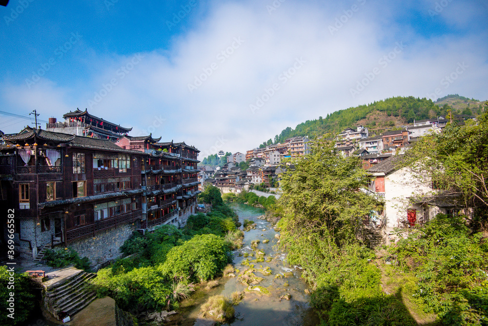 Street view local visitor and tourist in Furong Ancient Town (Furong Zhen, Hibiscus Town), China. Furong Ancient Town is famous tourism attraction place.