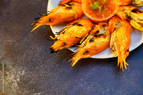 Grilled shrimp (Giant freshwater River prawn) grilling with charcoal at home, Natural Light in the evening. Bangkok, Thailand