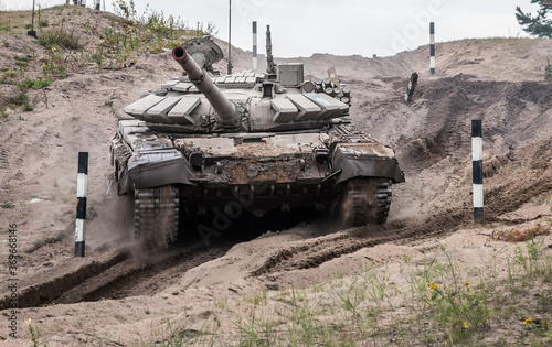 battle tank performs driving exercises for military equipment at the tankodrome photo