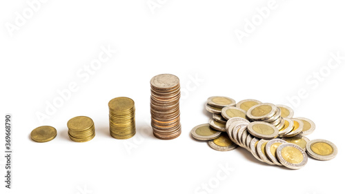 A collection of Thai  baht coins on a white background and clipping path. This coin is denominated in Thai baht. Arrange the coins into a bar chart showing business and financial growth.