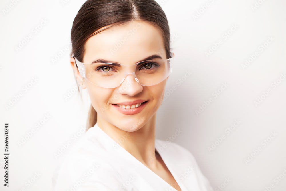 Young woman scientist with protective eyeglasses scientific chemical laboratory Young woman scientist with protective eyeglasses scientific chemical laboratory