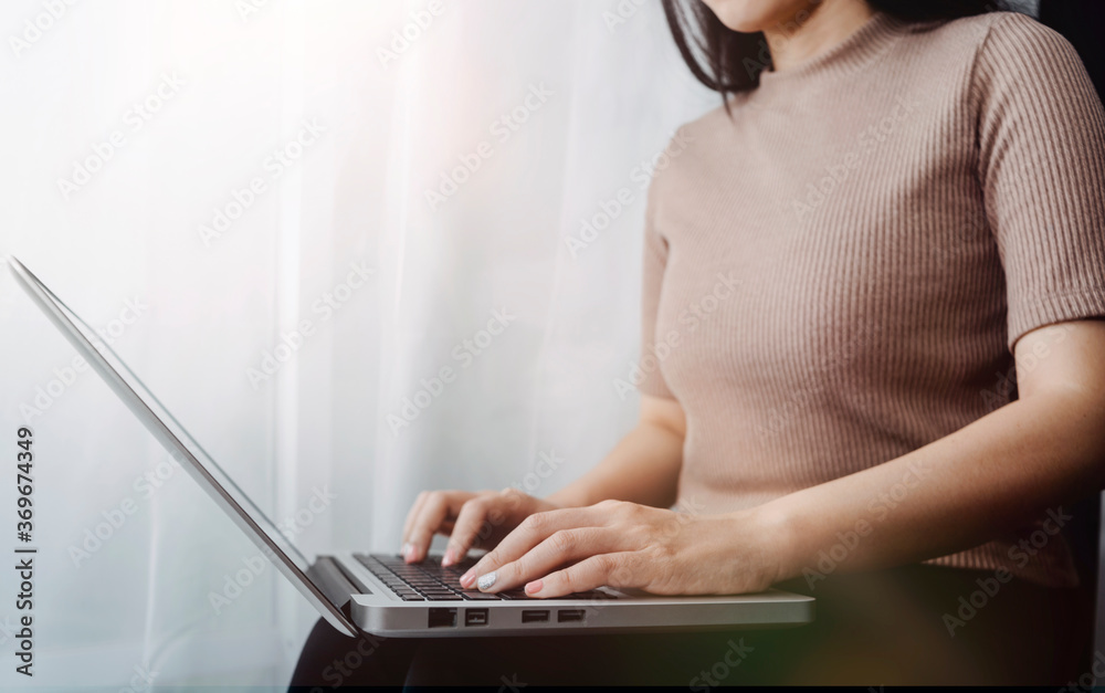 Naklejka premium businesswoman hand using smart phone, tablet payments and holding credit card online shopping, omni channel, digital tablet docking keyboard computer at office in sun light