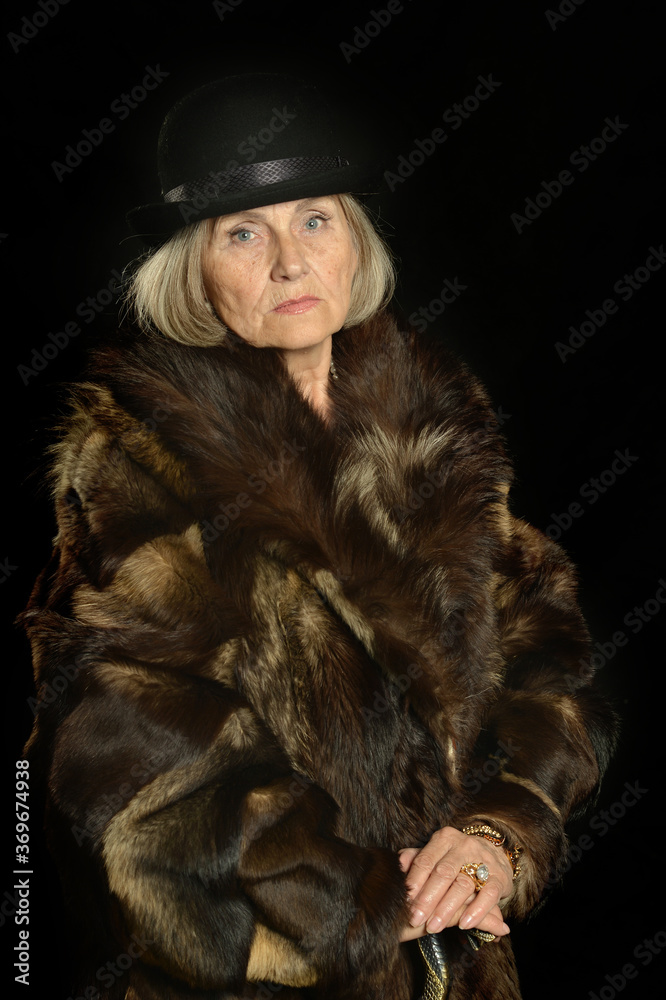 Portrait of senior woman in fur coat Portrait of senior woman in fur coat