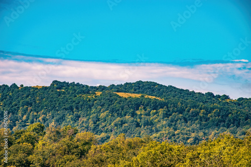 autumn landscape with mountains and sky
