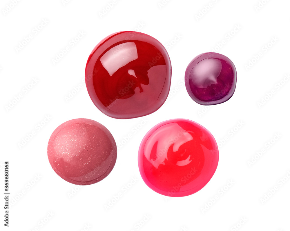Different lip glosses isolated on white Different lip glosses isolated on white
