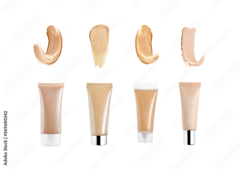 Fotografie Liquid foundation tubes and strokes isolated on white