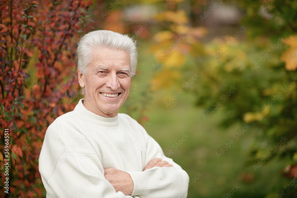 Portrait of happy senior man in park Portrait of happy senior man in park
