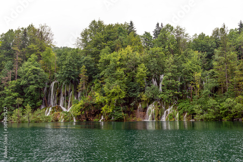 Beautiful waterfall and blue limpid lake in Plitvice Lakes National Park  Croatia