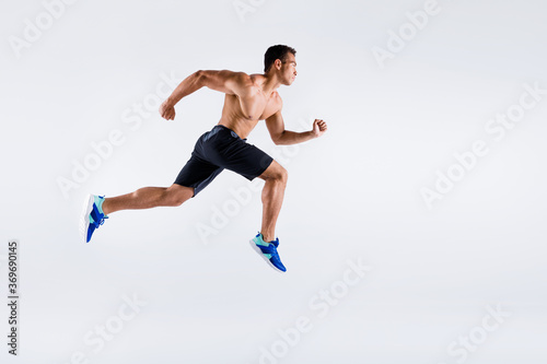 Full length body size view of his he nice attractive dedicated devoted sportive purposeful guy jumping running distance marathon cup isolated over light white pastel color background