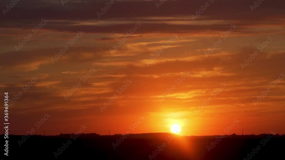 Great Quick Time lapse to show the Colorful Sunset and Clouds at Sunset. The sun Goes into the Field below the Horizon