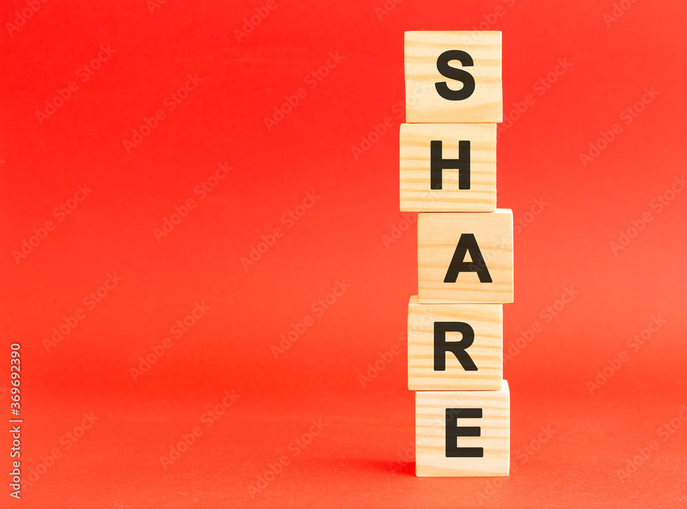 Wooden cubes with letters. For your design, concept. Wooden cubes on a red background. Free space on the left. Wooden cubes with letters. For your design, concept. Wooden cubes on a red background. Free space on the left.