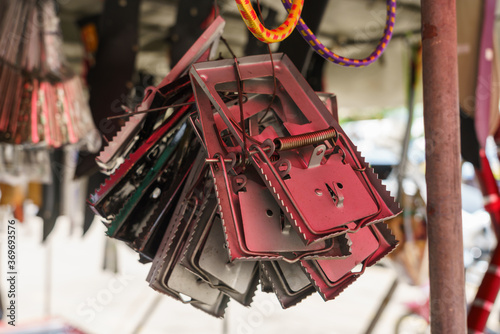 Many mouse traps are hung in the shops. photo