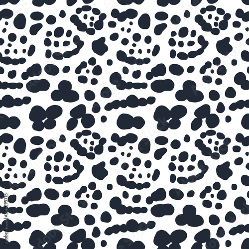 Abstract seamless pattern of black and white jaguar skin. Repeating texture. Figure for textiles. Surface design.