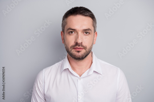 Close-up portrait of his he nice attractive content calm serious mature man qualified security manager wearing white shirt isolated over light gray pastel color background