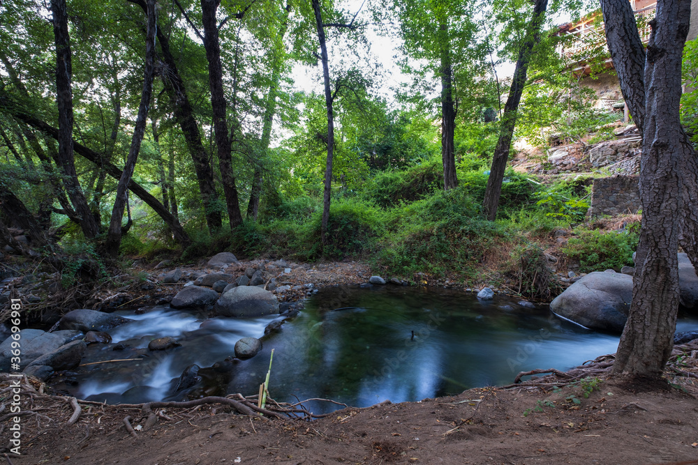 Pure water stream flowing over rocky mountain terrain in the Kakopetria forest,  Troodos, Cyprus