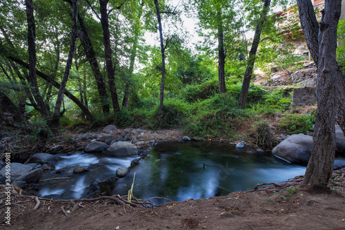 Pure water stream flowing over rocky mountain terrain in the Kakopetria forest, Troodos, Cyprus