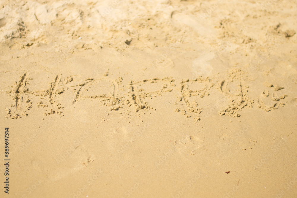 The inscription on the wet sand is The inscription on the wet sand is
