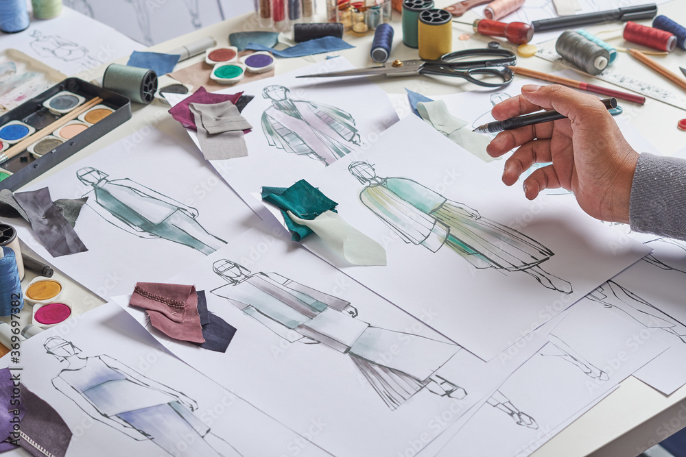 Fashion designer stylish drawings sketches textile fabric material Costume. Designer creative workshop studio. Fashion designer stylish drawings sketches textile fabric material Costume. Designer creative workshop studio.