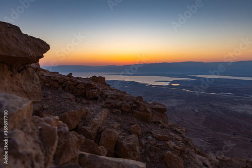 Dawn over the mountains of Jordan and the Dead Sea. View from the territory of the ruins of the Massada fortress in Israel.