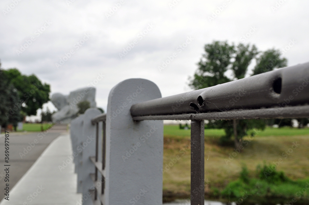 Bullet holes on the railing of the bridge, obtained during the war. Brest Fortress. Bullet holes on the railing of the bridge, obtained during the war. Brest Fortress.