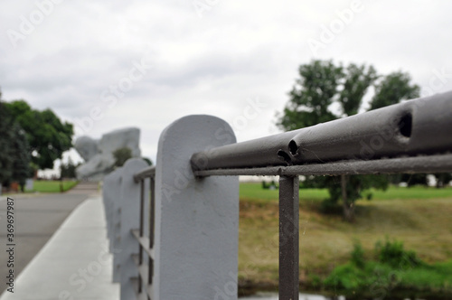 Bullet holes on the railing of the bridge, obtained during the war. Brest Fortress.