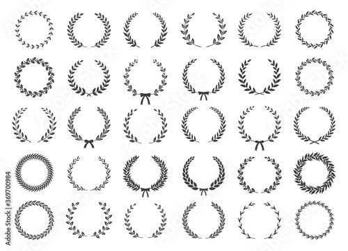 Set of black and white silhouette circular laurel foliate and oak wreaths depicting an award, achievement, heraldry, nobility. Vector illustration. photo