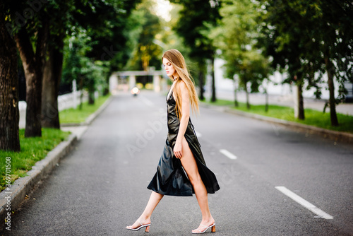 portrait beautiful girl in black dress outdoors © Pavel
