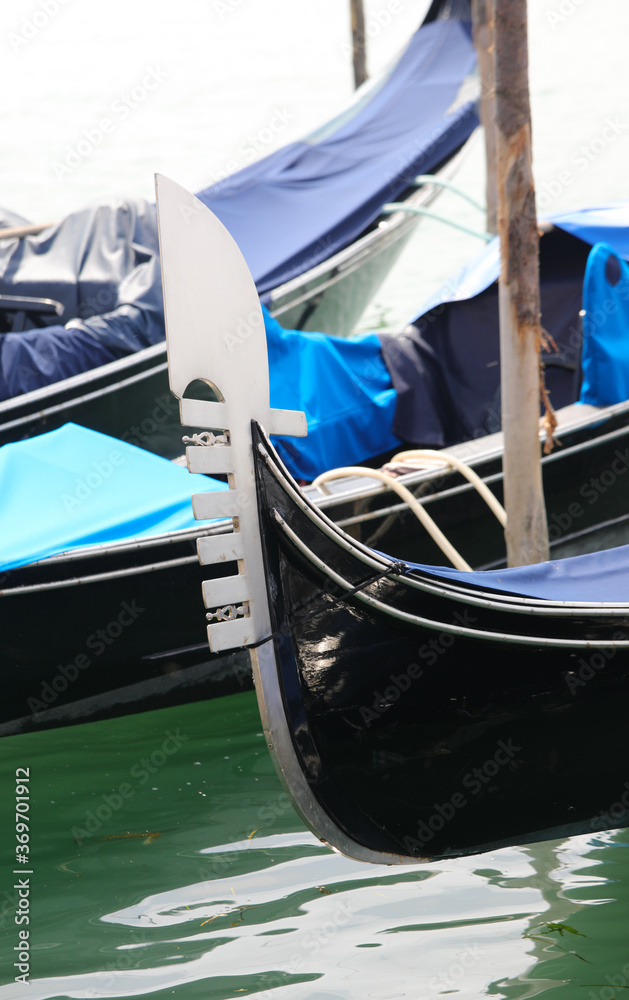 bow of the gondola in Venice which symbolizes the districts of t