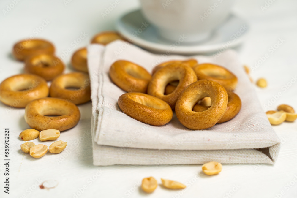 fresh bagels and peanuts on a cloth napkin close-up. morning concept