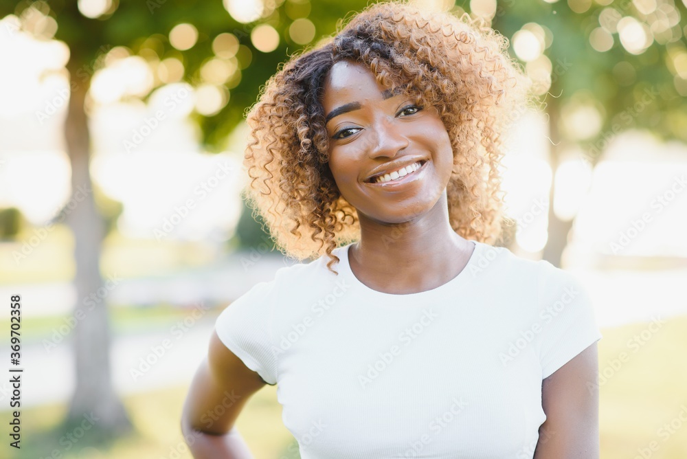 A young female african-american woman enjoying a day at the park A young female african-american woman enjoying a day at the park