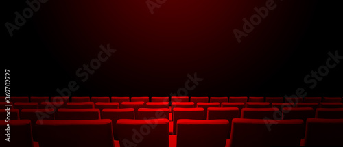 Cinema movie theatre with red seats rows and a black background. Horizontal banner