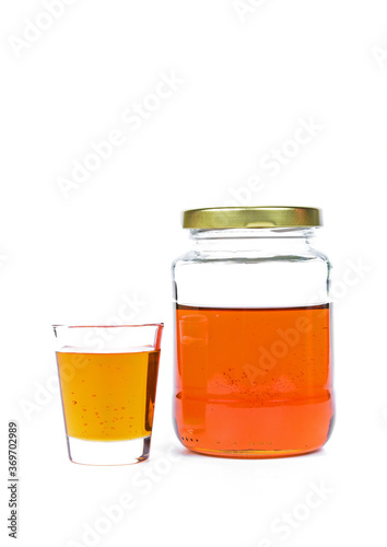 glass of fresh honey isolated on white background