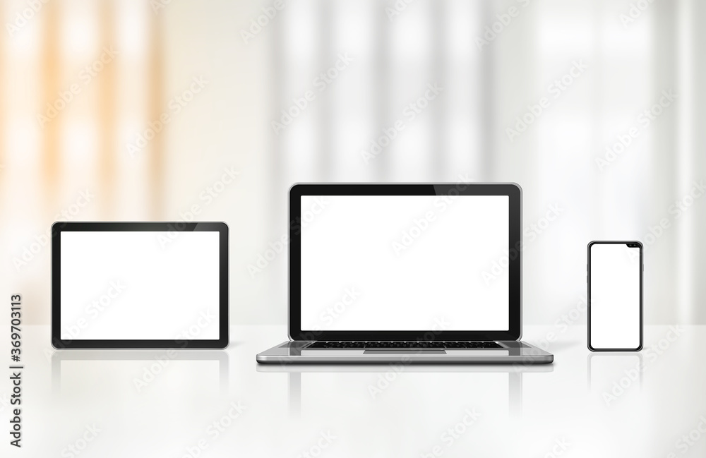 Fototapeta premium Laptop, mobile phone and digital tablet pc on office desk