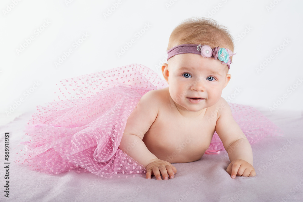 little cute baby lies, decoration on head, fluffy pink skirt little cute baby lies, decoration on head, fluffy pink skirt