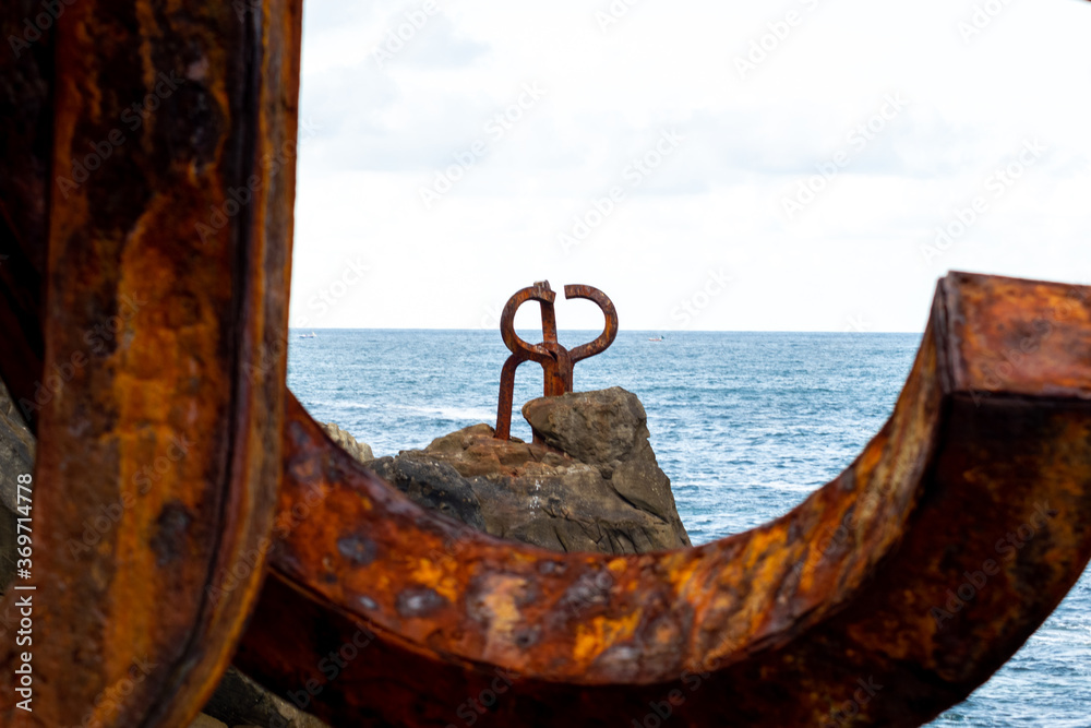 Fototapeta premium The Comb of the Wind (El Peine del Viento , 1976) is a collection of three sculptures by Eduardo Chillida and it is located at the western end of La Concha Bay, San Sebastián.