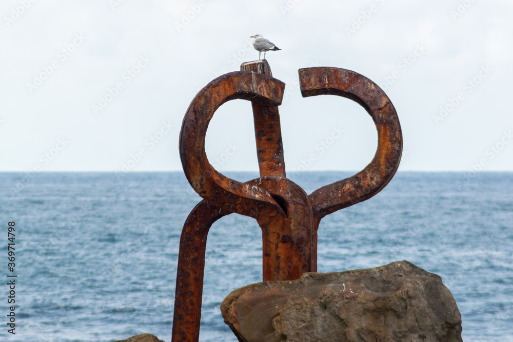 Fototapeta premium The Comb of the Wind (El Peine del Viento , 1976) is a collection of three sculptures by Eduardo Chillida and it is located at the western end of La Concha Bay, San Sebastián.