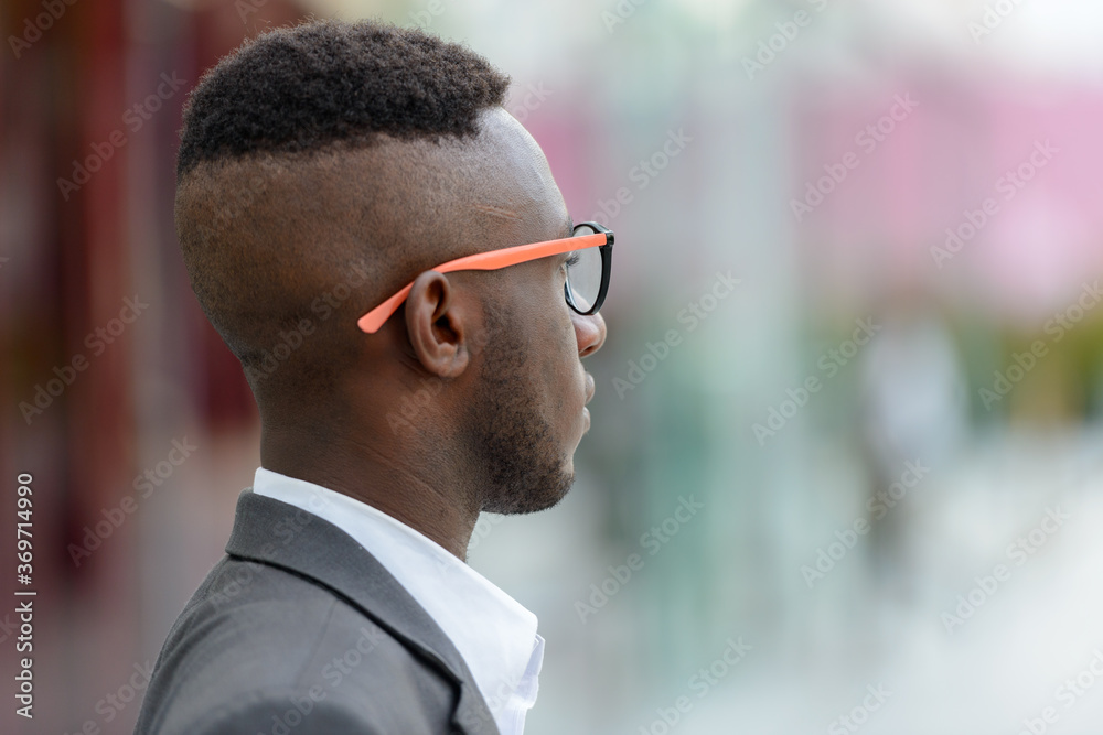 Young African businessman in the city outdoors